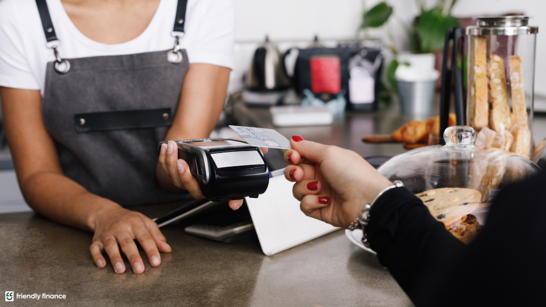 woman paying with credit card